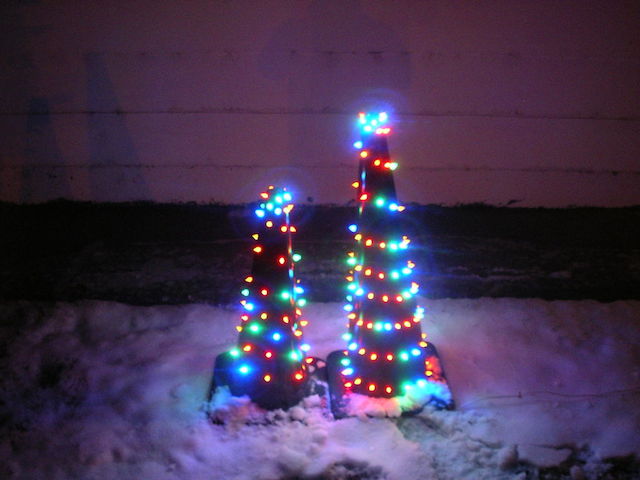 elaborately decorated traffic cones as college Christmas trees